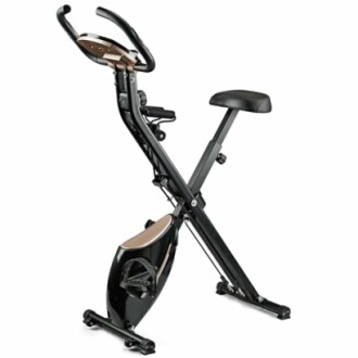 Foldable exercise bike with seat and handlebars.